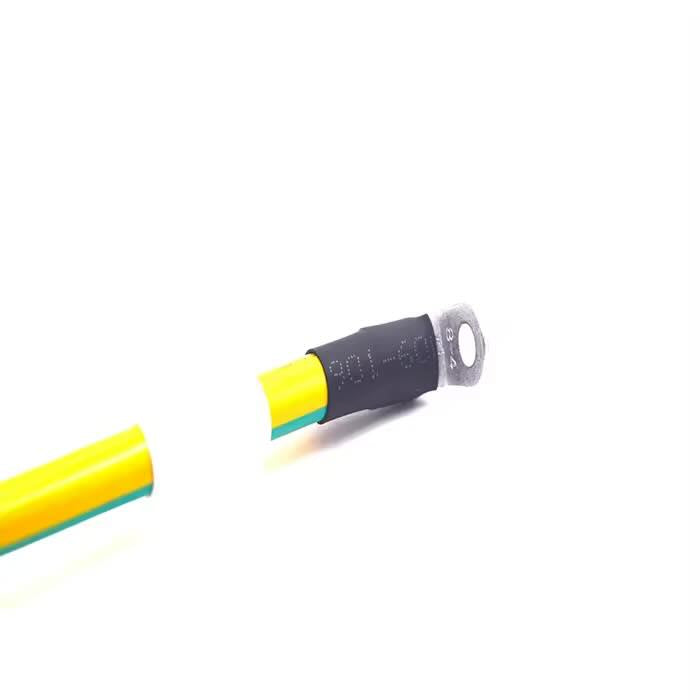 Custom industrial grounding cable assembly with ring terminal and HDC-65i3m2 plug interface.