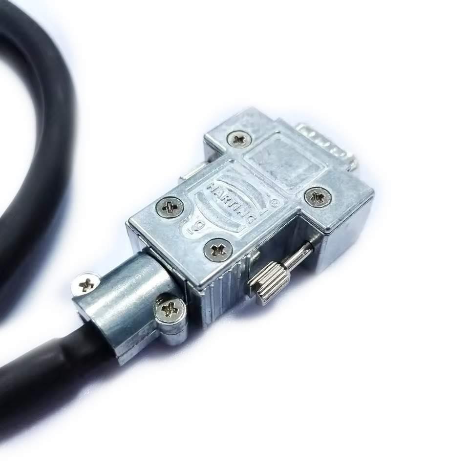 Precision gold-plated pins on a Harting DB9 male connector designed for high-reliability industrial serial data transmission.