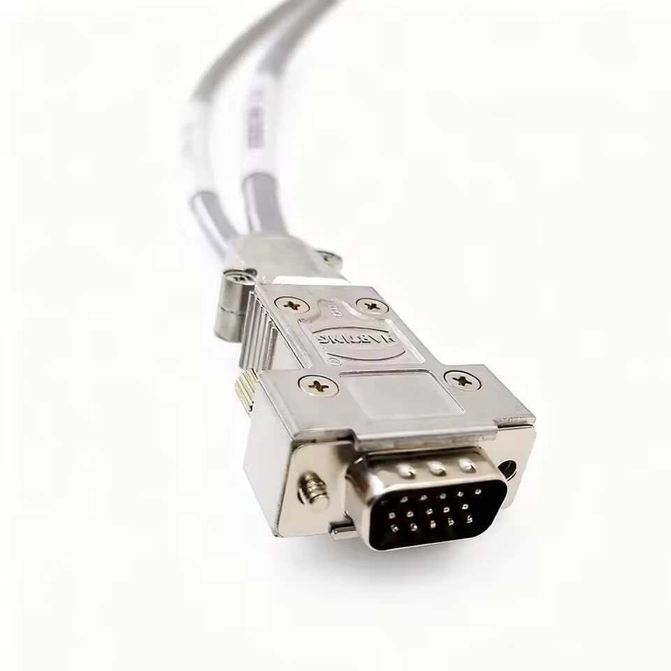 Precision gold-plated pin interface of a DB15 male connector within a shielded Harting metal hood for heavy-duty industrial automation.