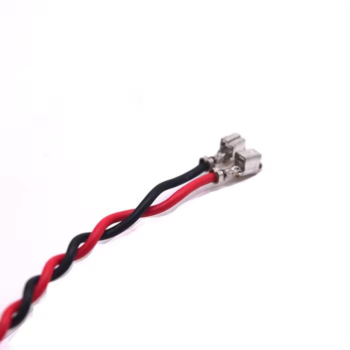 Detail of press-type terminal connectors on a flexible PVC-insulated internal power cable assembly.