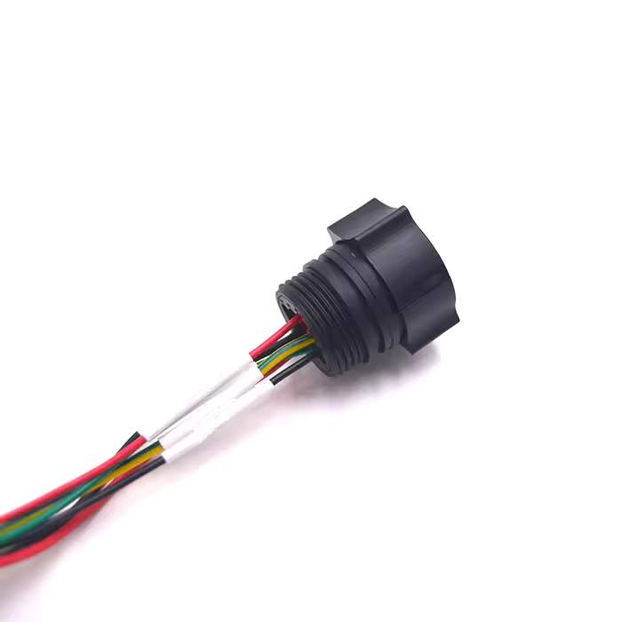 Close-up of 12-pole sealed connector interface on a high-reliability industrial cable assembly.