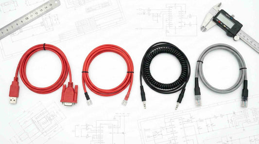 4 types of cable assemblies products laid on top of the designing drawings.