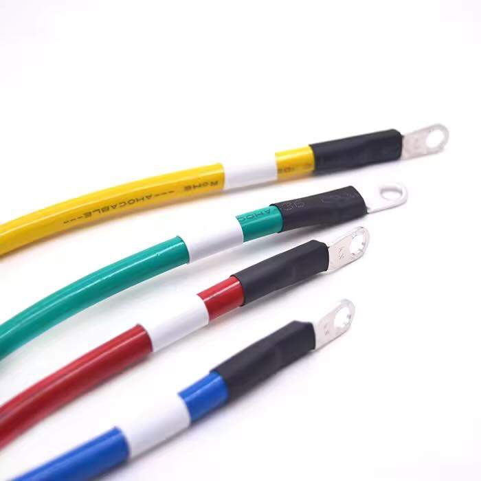 Custom inverter wire harness assembly showing pin terminal crimps on yellow, blue, green, and red cables.