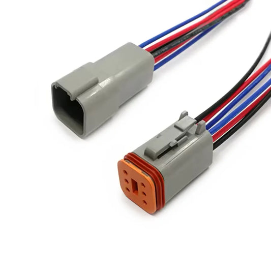 Deutsch DT04-6P receptacle mated to DT06-6S plug, 6-pin sealed wire harness with wedgelock retention.
