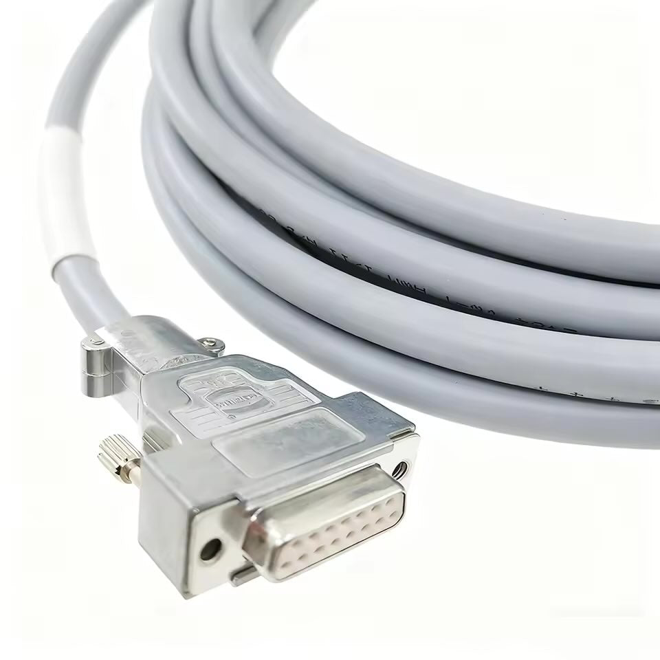 Close-up of a DB15 male connector with a Harting IP67-rated metal hood and gold-plated pins for industrial encoder extension.