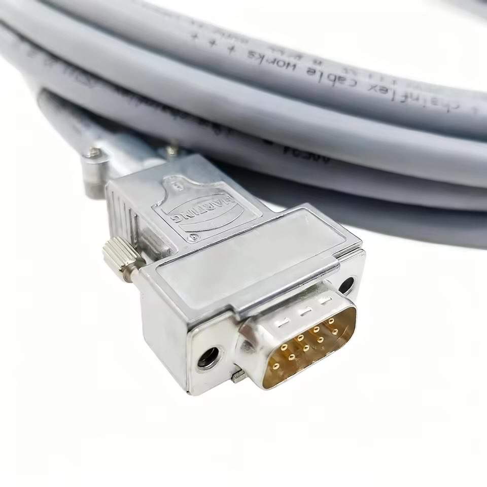 Close-up of a DB9 male connector with Harting metal hood and gold-plated pins for industrial encoder applications.