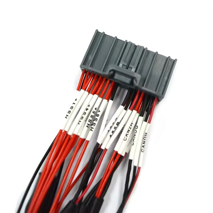 Detail shot of wire labels and crimping quality on JAE MX34036SF1 industrial cable assembly.
