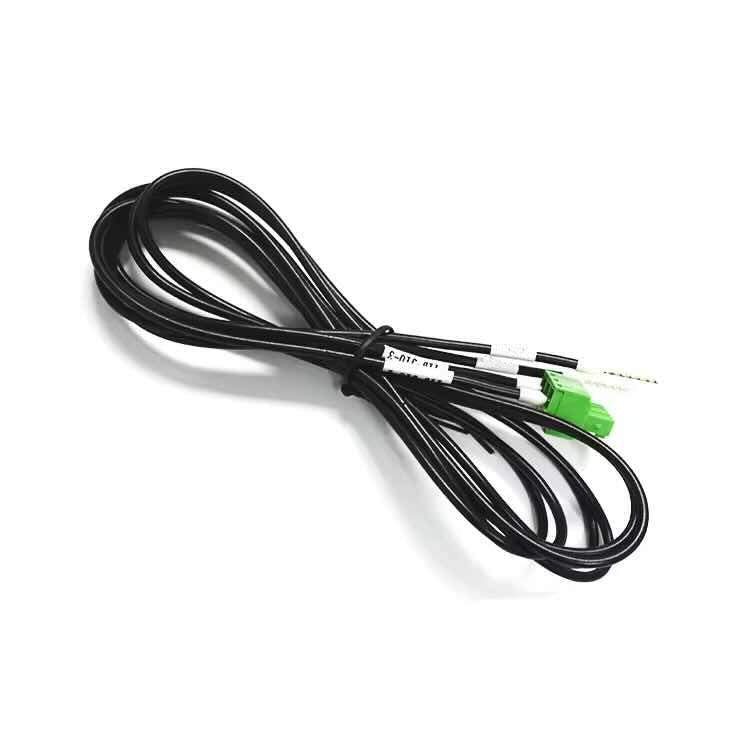 Coiled UL2462 22AWG black wire harness with green Phoenix Contact plug and crimped pin terminals.