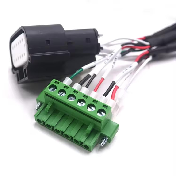 Close-up of wire identification labels and crimped ferrules on a 22AWG industrial cable assembly.