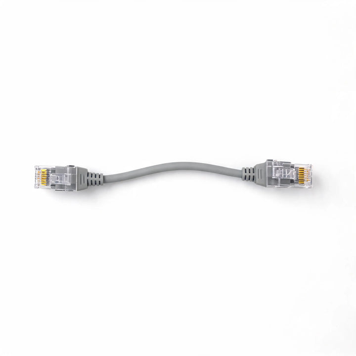 Gray Ethernet Cat6A cable with connectors on a white background